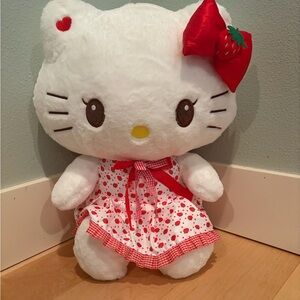18” Hello Kitty in strawberry print dress and red bow with strawberry accent